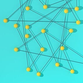 Image shows a geometric structure, with yellow balls connected by dark gray string, over a turquoise background